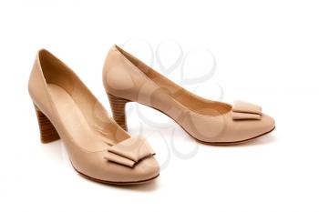 Pair of beige leather fashion women's shoes. Isolate on white.