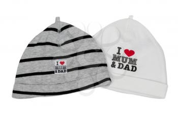 Two children's hats with the inscription I love my mom and dad