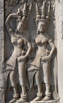 Mural carvings of Aspara dancers on the walls of Angkor Wat Cambodia