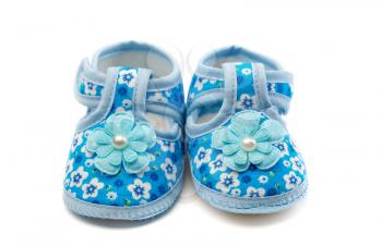 A pair of blue baby shoes. Isolate on white.