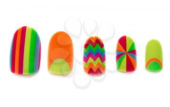 Colored, plastic artificial nails on a white background