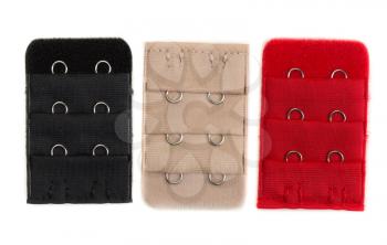 Three colored fasteners for bra (Extension), black, beige and red. Isolate on white.