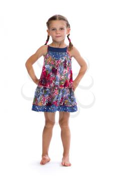 Girl in colorful dress in the studio, isolated on white background.