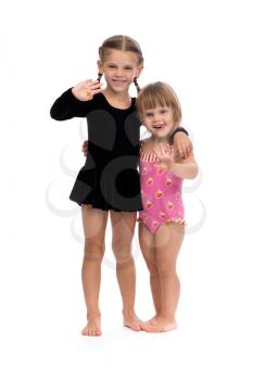 Two cute Ballerinas. Isolated on a white background. Studio shot.