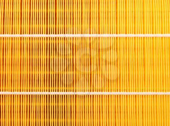 Background of a yellow car air filter closeup.