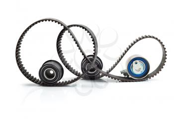 Timing belt, two rollers and the tension mechanism. Isolate on white background.