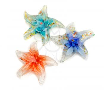 Three stars out of Murano glass isolated on white background.