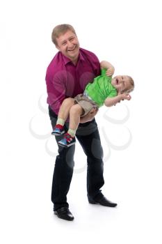 Portrait of a father and three year old son in her arms in the studio. Isolate on white.