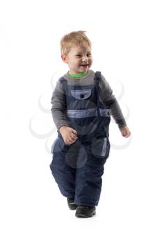 Little smiling boy 3 years winter pants in the studio. Isolate on white.