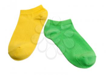 Two colored socks, yellow and green. Isolate on white.