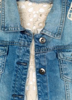 Close-up of blue denim jacket with lace