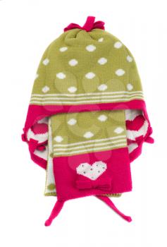Green knitted hat with polka dots and scarf. Isolate on white.