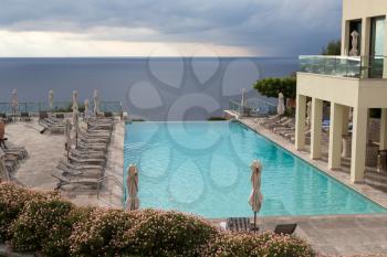 A luxury swimming pool situated with sea view
