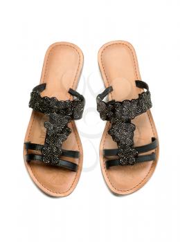 A pair of leather women's sandals. Top view. Studio. Isolate on white.