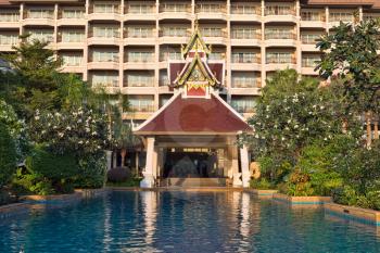 Swimming pool in a luxury Thai hotel lobby.
