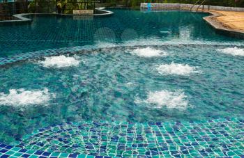 Swimming pool with hydro massage with tropical paradise of Thailand.