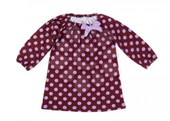 Brown baby dress with polka dots. Isolate on white.
