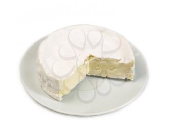 Round camembert cheese with a cut out piece isolated on white 