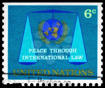 Royalty Free Photo of a Stamp Printed in the United Nations Shows the UN Emblem and Scales of Justice, Circa 1969