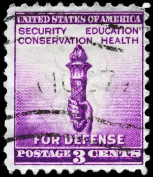 Royalty Free Photo of a 1940 US Stamp Showing the Torch of Enlightenment