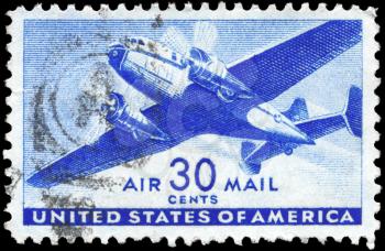 Royalty Free Photo of a 1941 US Stamp Showing a Twin-Motored Transport Plane