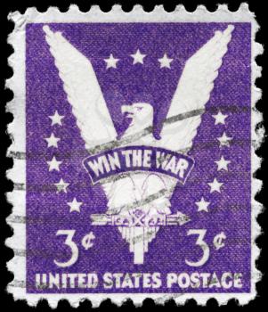 Royalty Free Photo of a 1942 US Stamp With the American Eagle, Bearing the Inscription Win the War