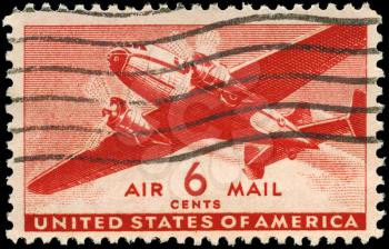Royalty Free Photo of a 1943 US Stamp of a Twin-Motored Transport Plane