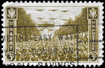 Royalty Free Photo of a 1945 US Stamp of US Troops Passing Arch Triumph, Paris