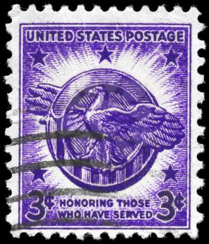 Royalty Free Photo of a 1946 US Stamp Showing an Honorable Discharge Emblem, Veterans of World War II Issue