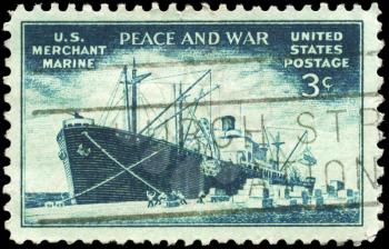 Royalty Free Photo of 1946 US Stamp Shows the Liberty Ship Unloading Cargo, Achievements of the US Merchant Marine in WWII