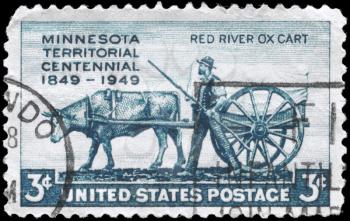 Royalty Free Photo of 1949 US Stamp Shows the Pioneer and Red River Oxcart, Minnesota Territory Issue