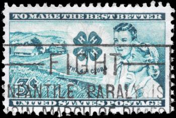 Royalty Free Photo of 1952 US Stamp Shows the Farm, Club Emblem, Boy and Girl, 4-H Club Issue