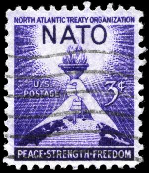 Royalty Free Photos of 1952 US Stamp Shows the Torch of Liberty and Globe, 3rd Anniversary of the Signing of the North Atlantic Treaty
