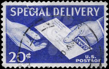 Royalty Free Photo of 1954 US Stamp Shows the Special Delivery Letter, Hand to Hand