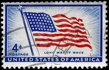 Royalty Free Photo of 1957 US Stamps Shows the Flag Old Glory with the Inscription Long May It Wave