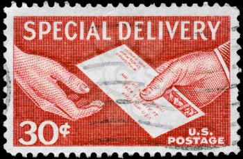 Royalty Free Photo of 1957 US Stamp Shows the Special Delivery Letter, Hand to Hand