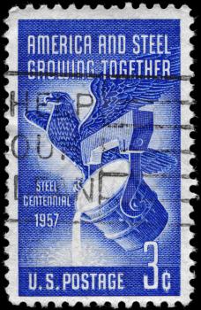 Royalty Free Photo of 1957 US Stamp Shows American Eagle and Pouring Ladle, Steel Industry Centenary
