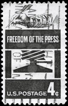 Royalty Free Photo of 1958 US Stamp Shows the Early Press and Hand Holding Quill, Freedom of the Press