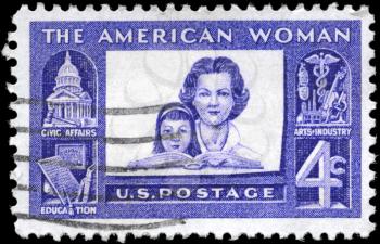 Royalty Free Photo of 1960 US Stamp Shows Mother and Daughter, American Woman Issue