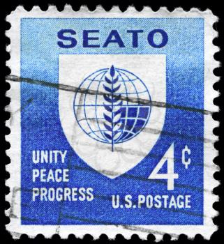 Royalty Free Photo of 1960 US Stamp Shows the SEATO Emblem, Inscribed Unity Peace Progres
