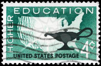 Royalty Free Photo of 1962 US Stamp Shows the Map of US and Lamp, Inscribed Higher Education