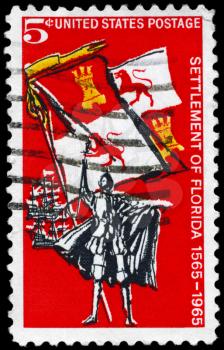 Royalty Free Photo of 1965 US Stamp Shows Spanish Explorer, Royal Flag of Spain and Ships, Settlement of Florida