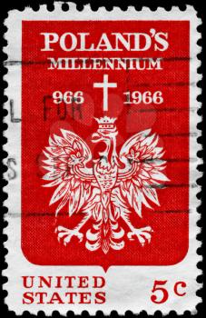 Royalty Free Photo of 1966 US Stamp Shows the Polish Eagle and Cross, for 1000th Anniversary of Christianity in Poland