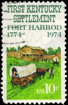 Royalty Free Photo of 1974 US Stamp Shows Ox Cart and Fort Harrod, Kentucky Settlement