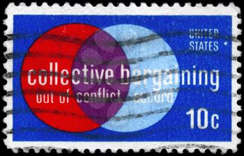 Royalty Free Photo of 1975 US Stamp Devoted to Collective Bargaining Law, Enacted 1935 with Wagner Act