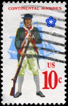 Royalty Free Photo of 1975 US Stamp Shows the Marine with Musket, Full-Rigged Ship, Military Uniforms