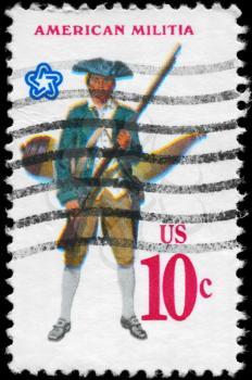Royalty Free Photo of 1975 US Stamp Shows the Militiaman with Musket, Powder Horn, Military Uniforms
