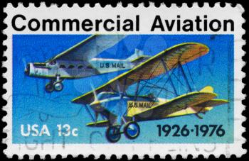 Royalty Free Photo of 1976 Stamp Shows the Ford-Pullman Monoplane & Laird Swallow Biplane, Commercial Aviation 50th Anniversary