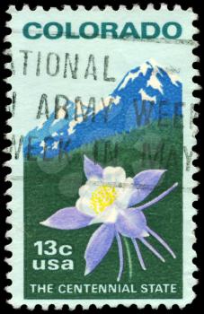Royalty Free Photo of 1977 US Stamp Shows the Columbine and Rocky Mountains, Colorado Statehood