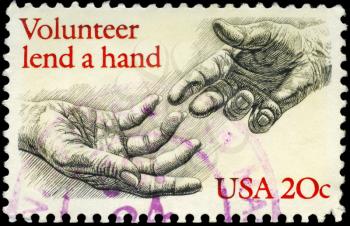 Royalty Free Photo of 1983 US Stamp Shows the Human Hands, Inscribed Volunteer Lend a Hand